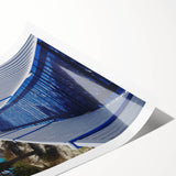 Extra large wall art featuring line art flowers in muted green and blue tones on a rolled canvas.