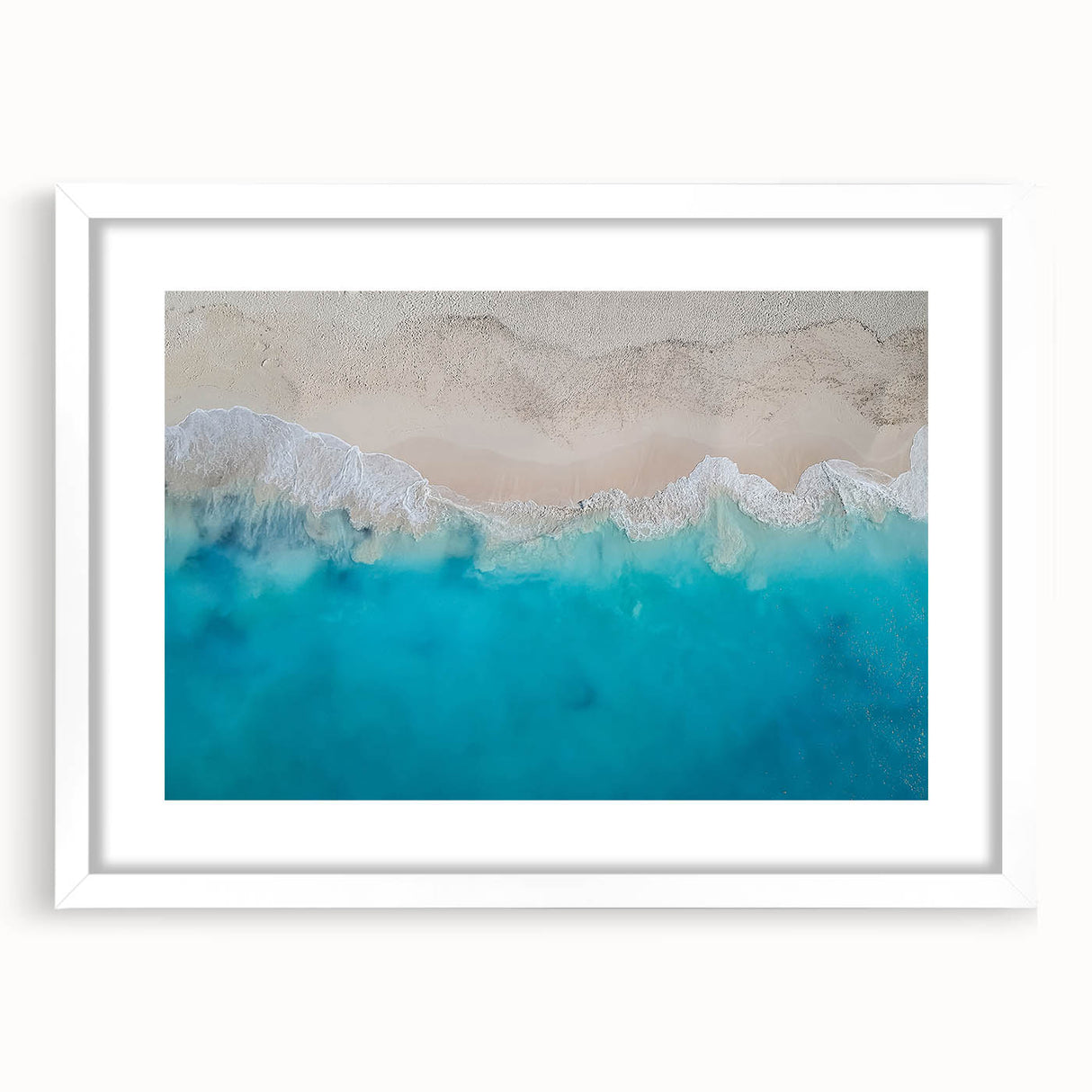 Textured abstract art print of Caribbean scenery in muted blue and white, framed with a white mat, ideal for bedroom decor.