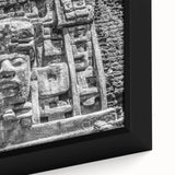 Black wall art featuring a textured, colorful abstract design on a framed canvas.