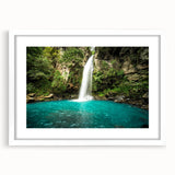 Abstract art print of Costa Rica scenery in muted green and blue tones on a white framed mat, suitable for dining room decor.