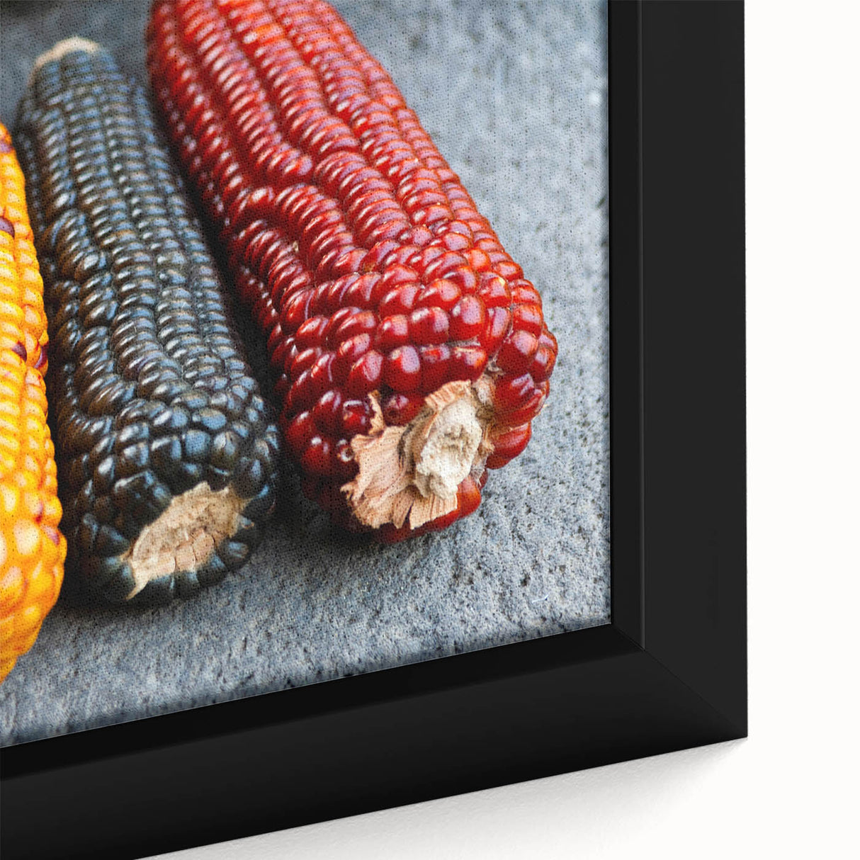 Close-up of a framed canvas featuring a textured, colorful Central American landscape in black, ideal for living room decor.