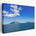 Side view of a stretched canvas depicting a Central American scenery in vibrant green and blue tones.