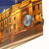 Large abstract wall art of a European scenery in muted green and blue tones on acrylic glass.