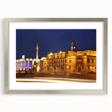 Textured abstract art print of an Albanian landscape in muted earth tones, framed in silver, ideal for bedroom art.