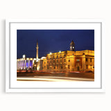 Abstract art print of a European landscape in muted blue and green tones, framed with a white mat.