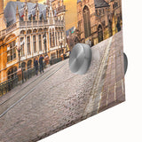 Large abstract wall art featuring a mid-century modernist depiction of a European cityscape in muted tones.