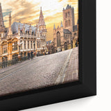 Extra large framed canvas featuring a textured depiction of a European scenery in black with colorful accents.
