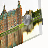 Large abstract wall art depicting a European scenery in muted earth tones on acrylic glass.