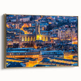 Framed canvas of a vintage-style landscape painting featuring Bath, England, in muted gold and black tones.