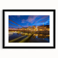Abstract art print of Lyon scenery in vibrant colors on a textured canvas, framed in black, ideal for living room decor.