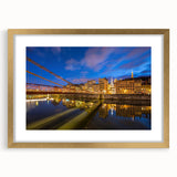 Abstract art print of Lyon scenery in muted gold and blue tones on a framed canvas, suitable for dining room decor.