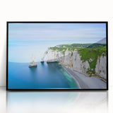 Large abstract wall art depicting a serene Normandy landscape in muted greens and blues, framed in black acrylic.