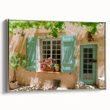 Framed canvas depicting a vintage-style landscape painting of southern France, featuring colorful art in muted tones.