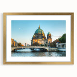 Abstract art print of Berlin scenery in muted gray and gold tones, framed with a gold mat, suitable for dining room decor.