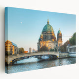 A panoramic view of Berlin's skyline on a large stretched canvas, featuring muted gray and blue tones.
