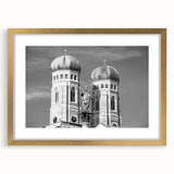 Abstract art print of Munich skyline in muted gold and blue tones on a framed canvas, suitable for dining room decor.