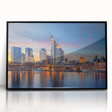 Large abstract wall art depicting a European cityscape in muted gray tones, framed in black acrylic.