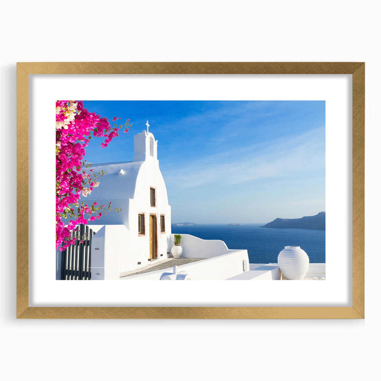 Abstract art print of Santorini with white buildings and blue domes, in a gold frame, suited for dining room decor.