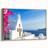 Framed canvas of Santorini landscape with gold frame, featuring blue and white buildings, ideal for bedroom wall art.
