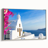 Framed canvas of a vintage-style Santorini landscape with vibrant blue and white tones, ideal for living room decor.