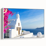 Vintage poster art of Santorini with vibrant blue and white tones on a framed canvas, ideal for living room decor.