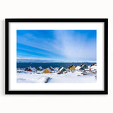 Abstract art print of Greenland scenery in vibrant greens and blues on a textured, extra-large canvas, framed in black.
