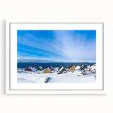 Textured art print featuring abstract shapes in muted green and white tones, framed with a white mat.