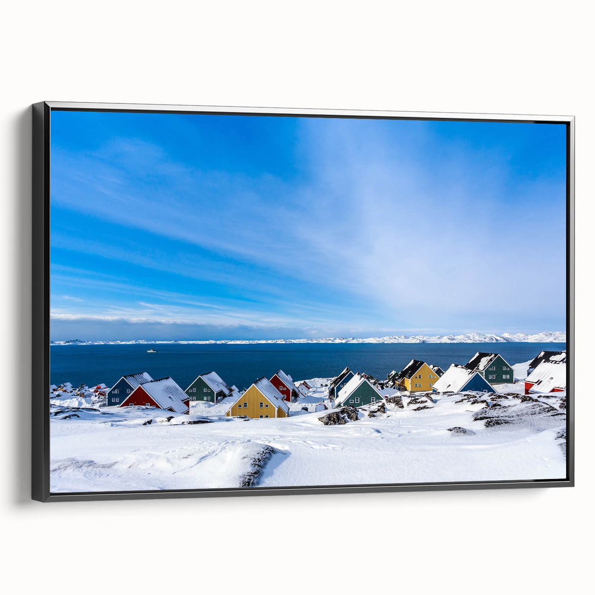 Black and white wall art featuring a vintage poster style landscape of Greenland on a framed canvas.