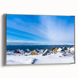 Framed canvas featuring a vintage-style landscape painting of Greenland with muted green and blue tones.