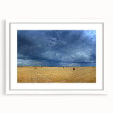 Textured art print of an abstract European scenery in muted earth tones, framed with a white mat, suitable for bedroom decor.