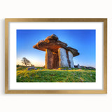 Abstract art print of an Irish landscape in muted green and blue tones, framed with a gold mat.