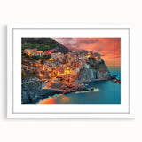 Textured art print of Cinque Terre with vivid blue and terracotta hues on a framed white mat, suitable for bedroom decor.