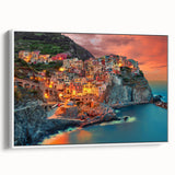 Vintage poster art of Cinque Terre with colorful buildings on a white framed canvas, ideal for living room decor.