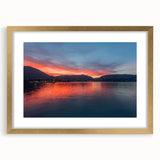 Abstract art print of Lake Como with muted blue and green tones on a framed gold mat, ideal for dining room decor.