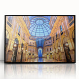 Large abstract wall art depicting Milan's cityscape in muted gray and blue tones on framed acrylic.