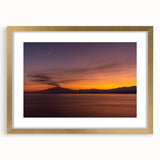 Abstract art print of Mount Etna with vibrant orange and gray tones on a gold-framed canvas, suitable for dining room decor.
