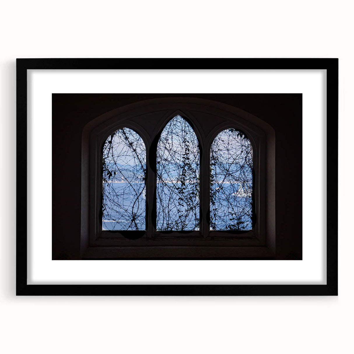 Colorful abstract art print of Portofino, Italy, in a black frame with mat, ideal for living room decor.