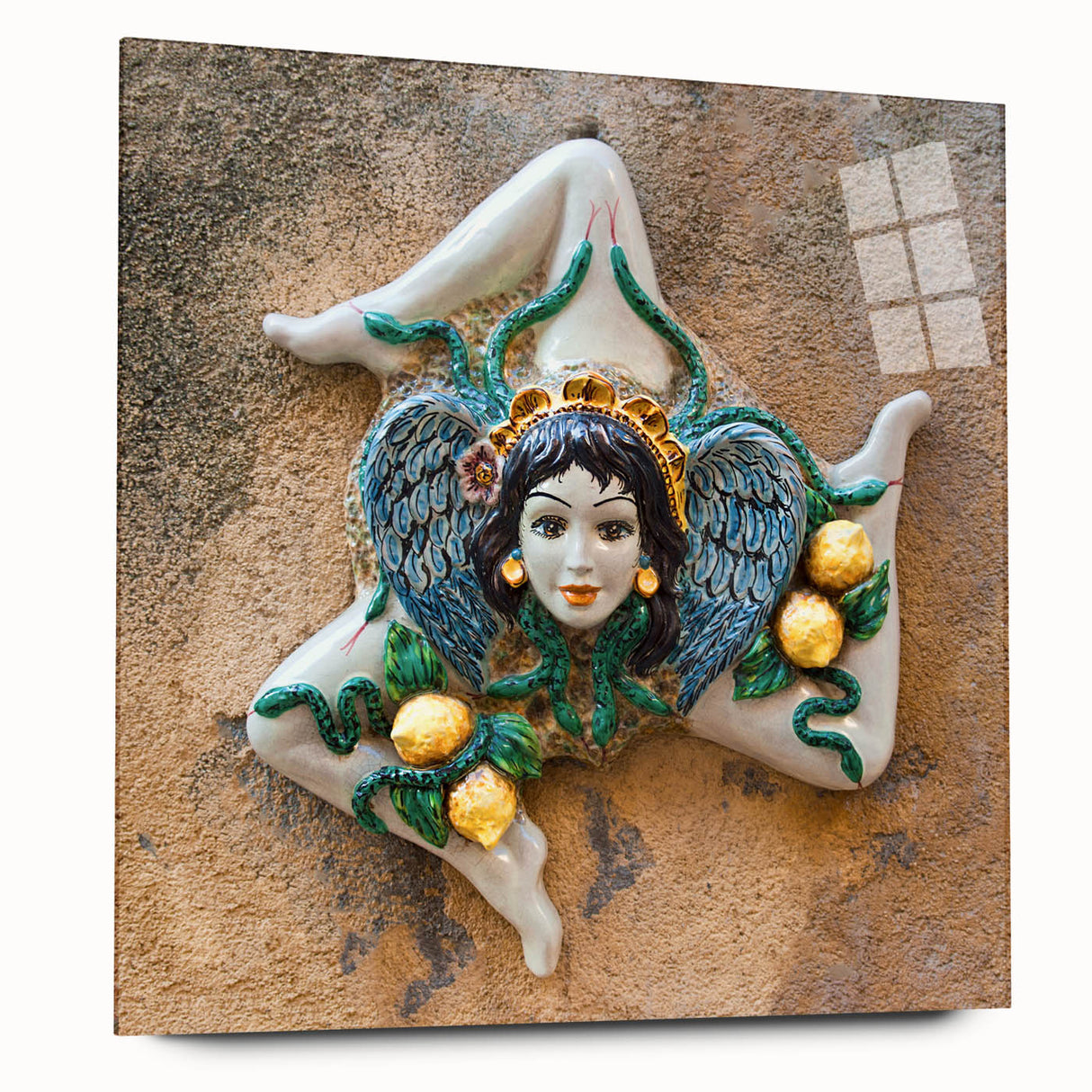 Large abstract wall art depicting the Sicilian coastline in muted blue and green tones on acrylic glass.