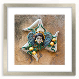 Extra large abstract art print of a Sicilian landscape in muted earth tones on a silver-framed canvas.