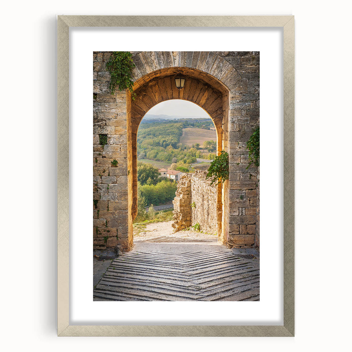Extra large wall art depicting an abstract Tuscan landscape in muted earth tones, framed in silver.