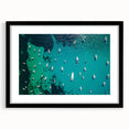 Colorful abstract art print of the Mediterranean Sea, in a black frame with mat, ideal for living room decor.