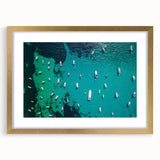 Abstract art print of the Mediterranean Sea in muted blue tones on a framed canvas, ideal for dining room decor.