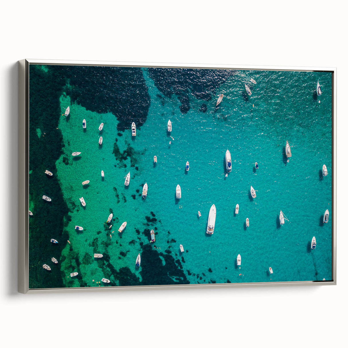 Framed canvas depicting a Mediterranean seascape in a vintage poster style, featuring vibrant blue and silver tones.