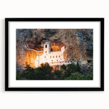 Abstract art print of a European scenery in vibrant colors, textured on a large black-framed canvas.