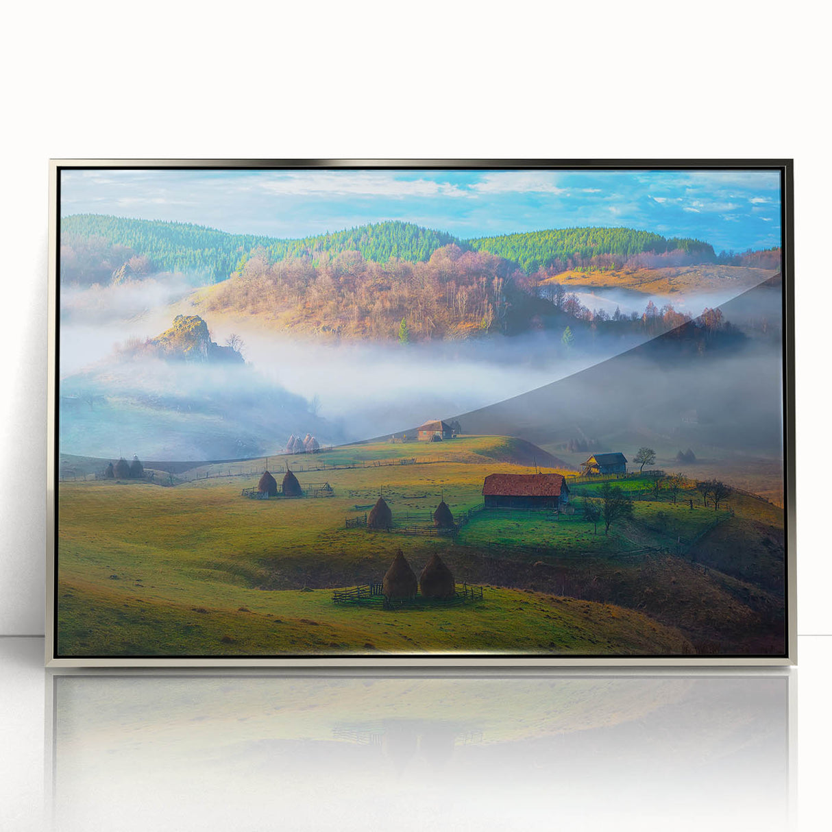 Large art print of a European Romanian scenery in muted earth tones, framed in silver acrylic.