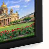 Framed canvas of a textured, colorful depiction of a European cityscape in primarily black tones.