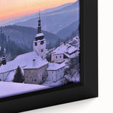 Close-up of a black framed canvas featuring a textured, colorful European landscape, ideal for living room decor.