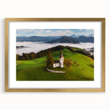 Textured art print of an abstract Slovenian landscape in muted earth tones, framed in gold, ideal for bedroom decor.
