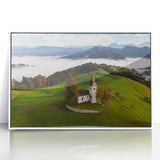 Framed acrylic print of a Slovenian landscape in muted green and blue tones, ideal for modern art wall decor.