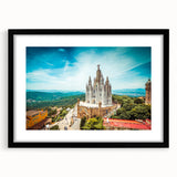 Abstract art print of Barcelona with vibrant, colorful textures on a framed black mat, ideal for living room decor.